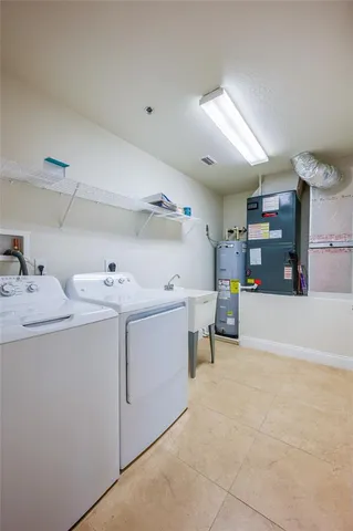 a dining room with wooden floor and large windows