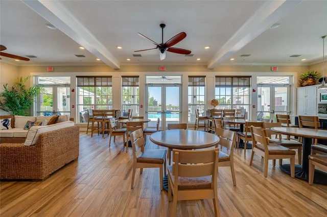 a view of swimming pool with outdoor seating and yard in back