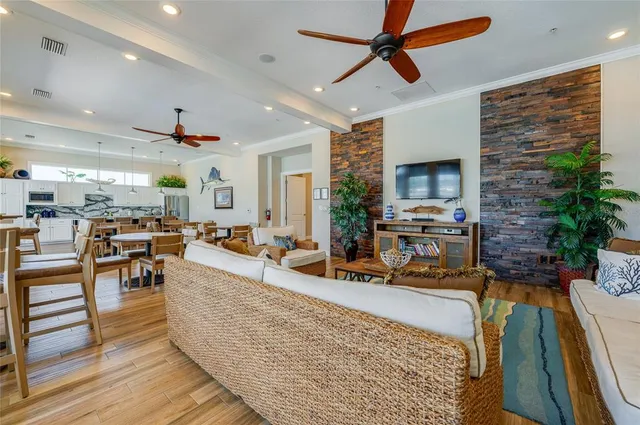 a living room with large windows and wooden floor