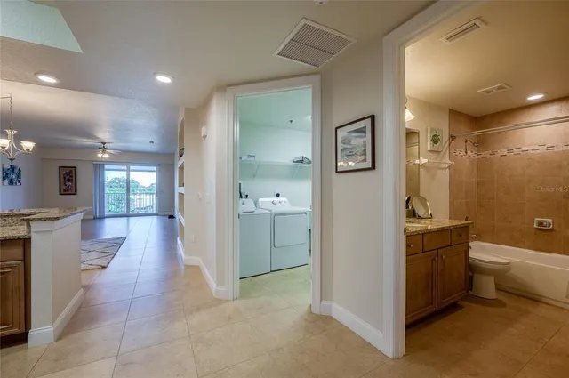 a kitchen with a refrigerator and a sink