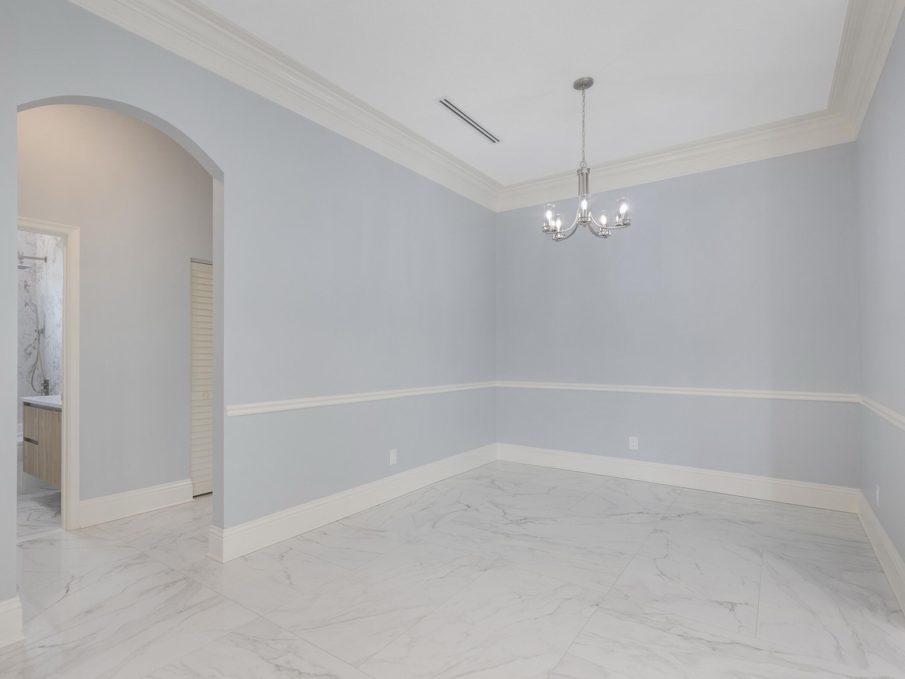 17436 71st Lane North Loxahatchee, FL 33470 - Photo 18 of 50 a view of a room with a fan and window