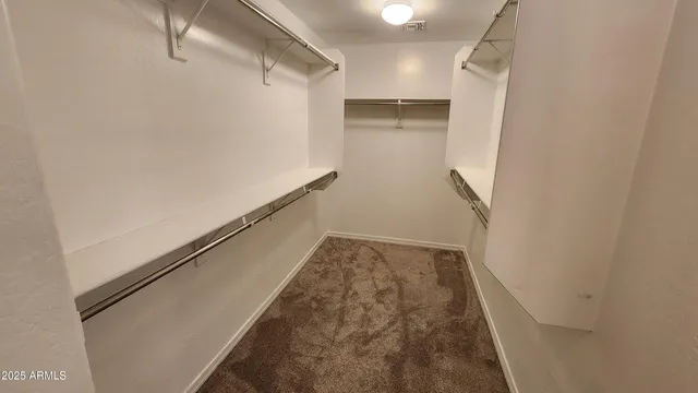 a view of an empty room with stairs