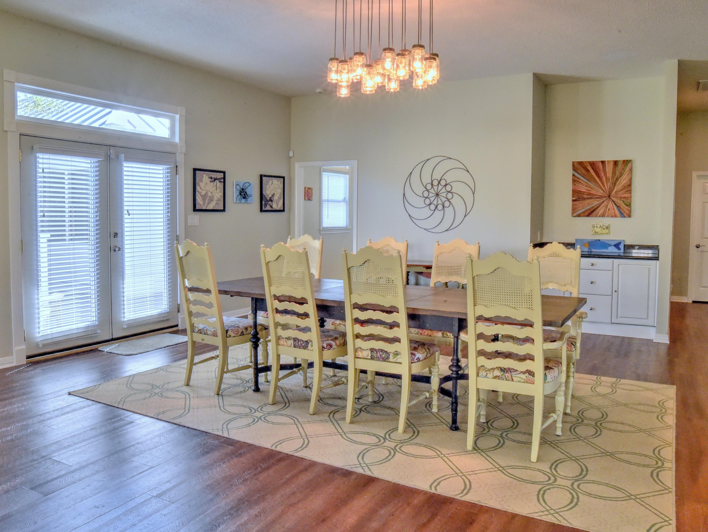 16 Bullard Road Santa Rosa Beach, FL 32459 - Photo 14 of 55 a view of a dining room with furniture wooden floor and a chandelier