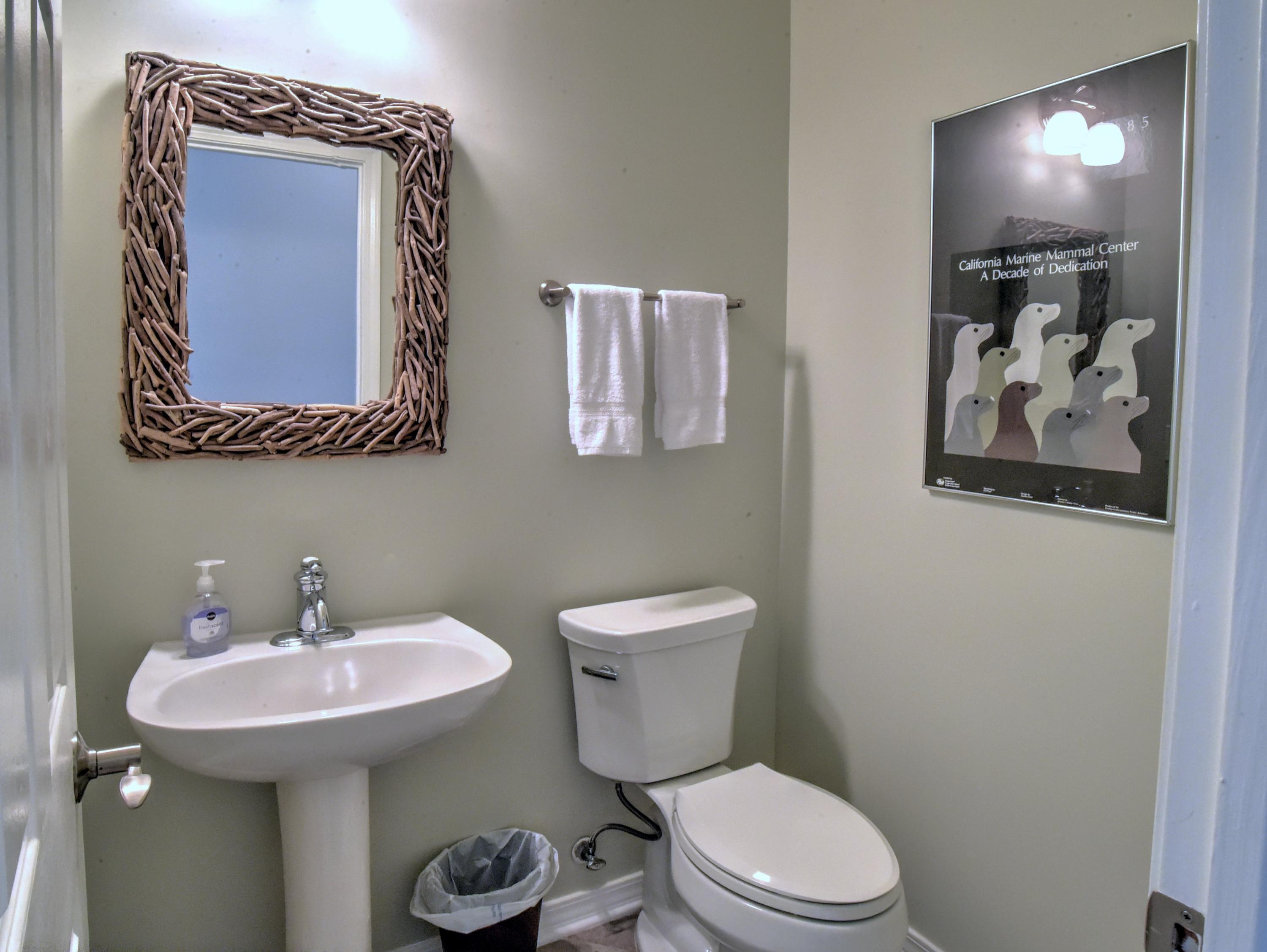 16 Bullard Road Santa Rosa Beach, FL 32459 - Photo 40 of 55 a bathroom with a toilet a sink and mirror