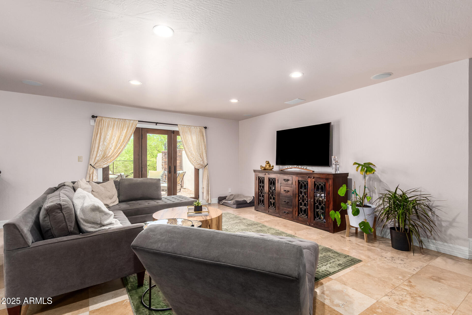 5803 North 45th Street Phoenix, AZ 85018 - Photo 25 of 72 a living room with furniture and a flat screen tv