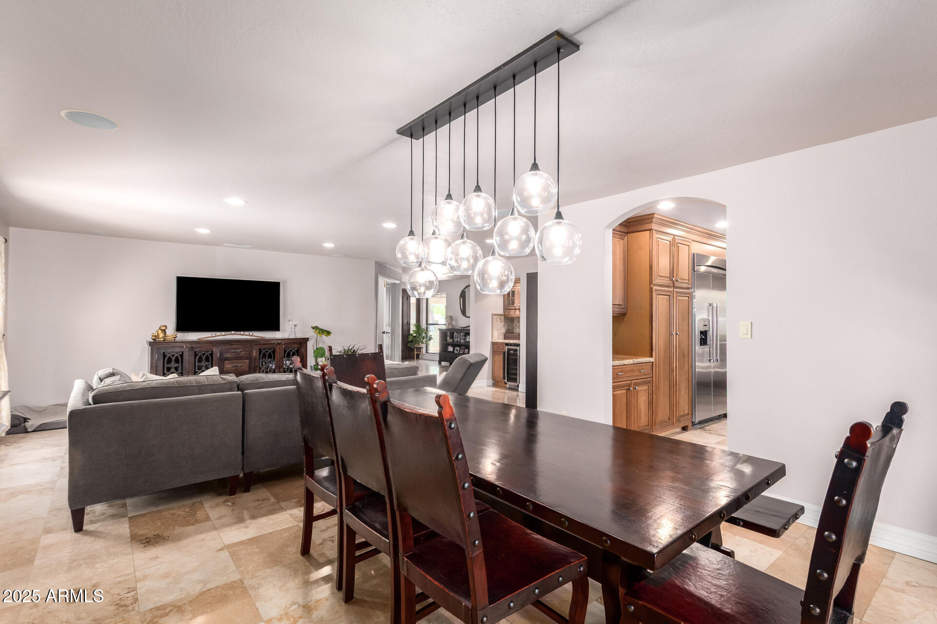 5803 North 45th Street Phoenix, AZ 85018 - Photo 27 of 72 a living room with furniture a flat screen tv and a table