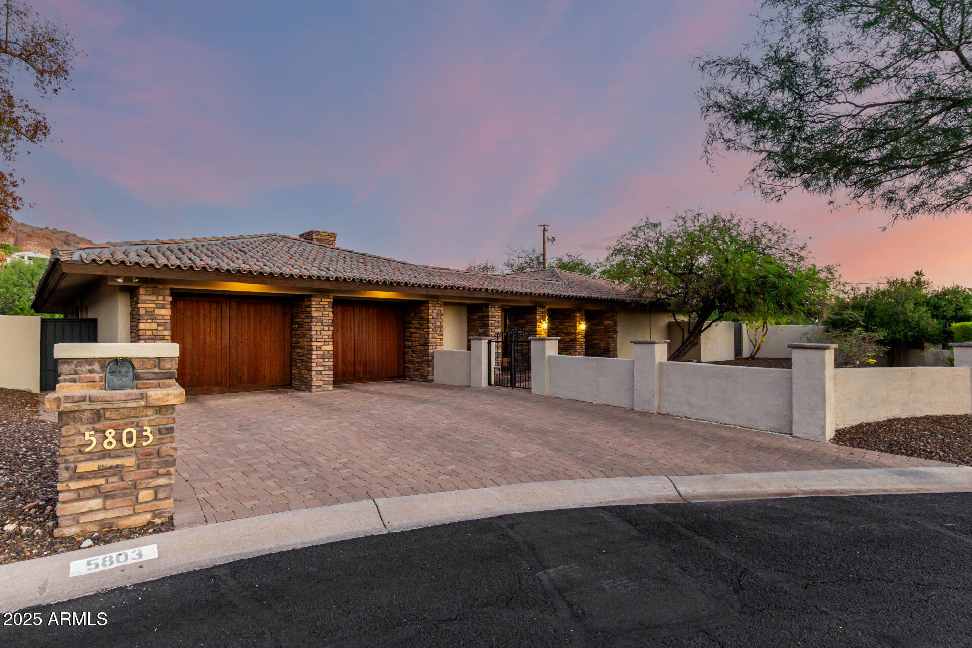 5803 North 45th Street Phoenix, AZ 85018 - Photo 2 of 72 a front view of a house with a yard and garage