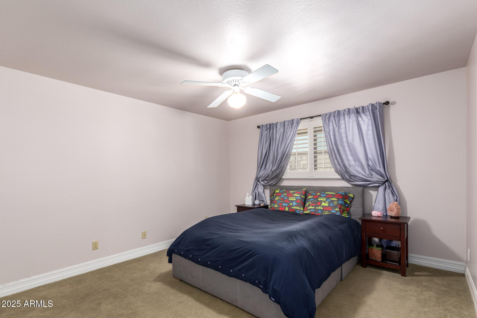 5803 North 45th Street Phoenix, AZ 85018 - Photo 32 of 72 a bedroom with a bed and a window