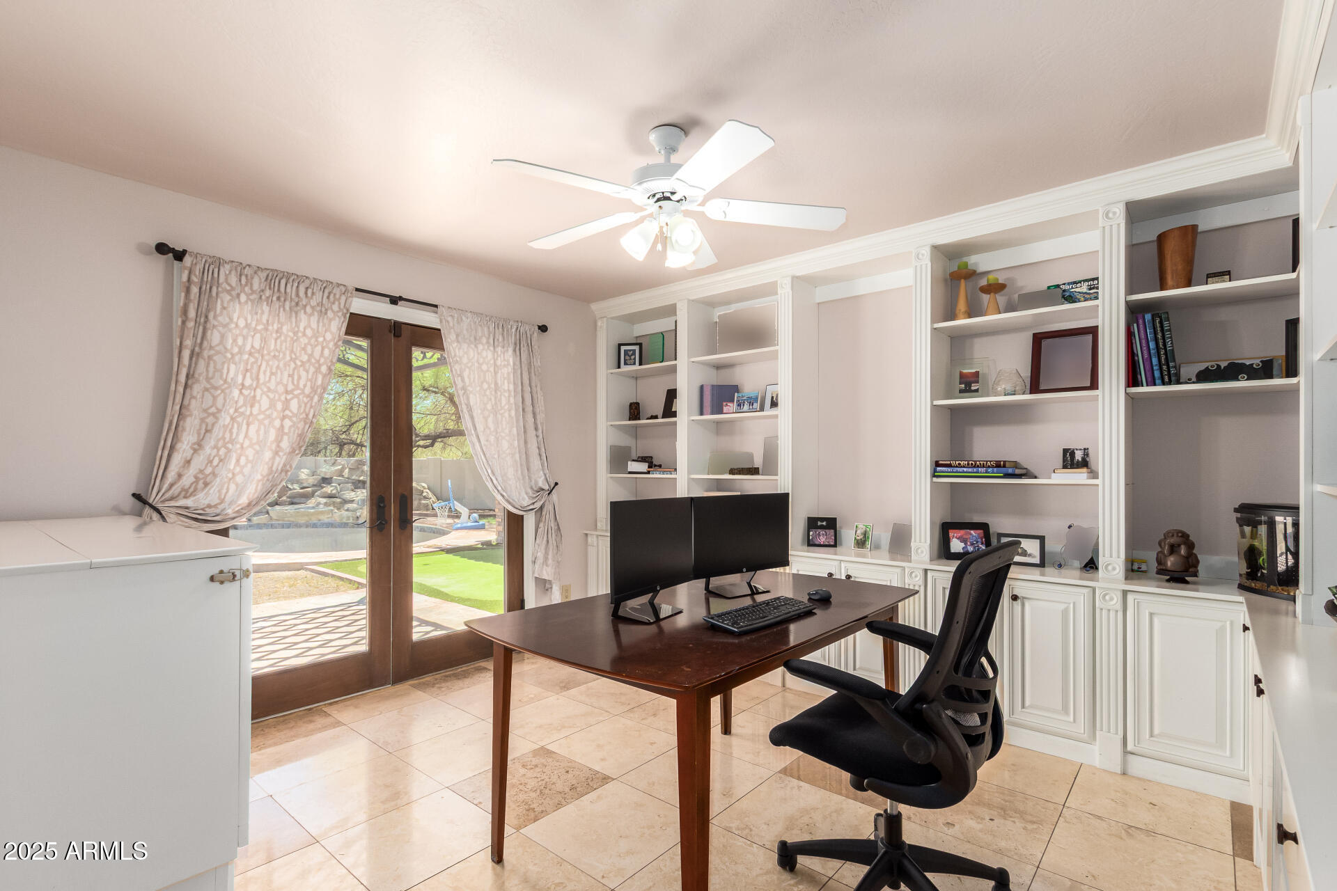 5803 North 45th Street Phoenix, AZ 85018 - Photo 34 of 72 a view of a workspace with furniture and a window
