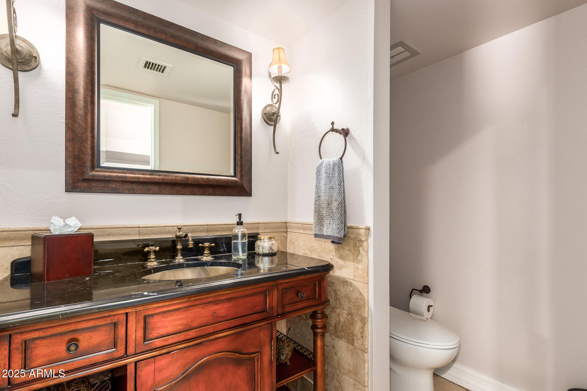 5803 North 45th Street Phoenix, AZ 85018 - Photo 38 of 72 a bathroom with a sink a toilet and a mirror