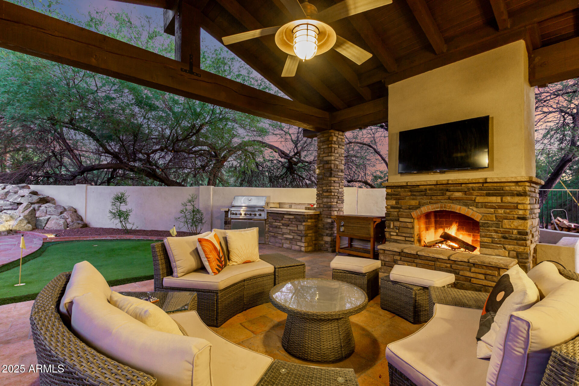 5803 North 45th Street Phoenix, AZ 85018 - Photo 3 of 72 a outdoor living space with furniture and a fireplace