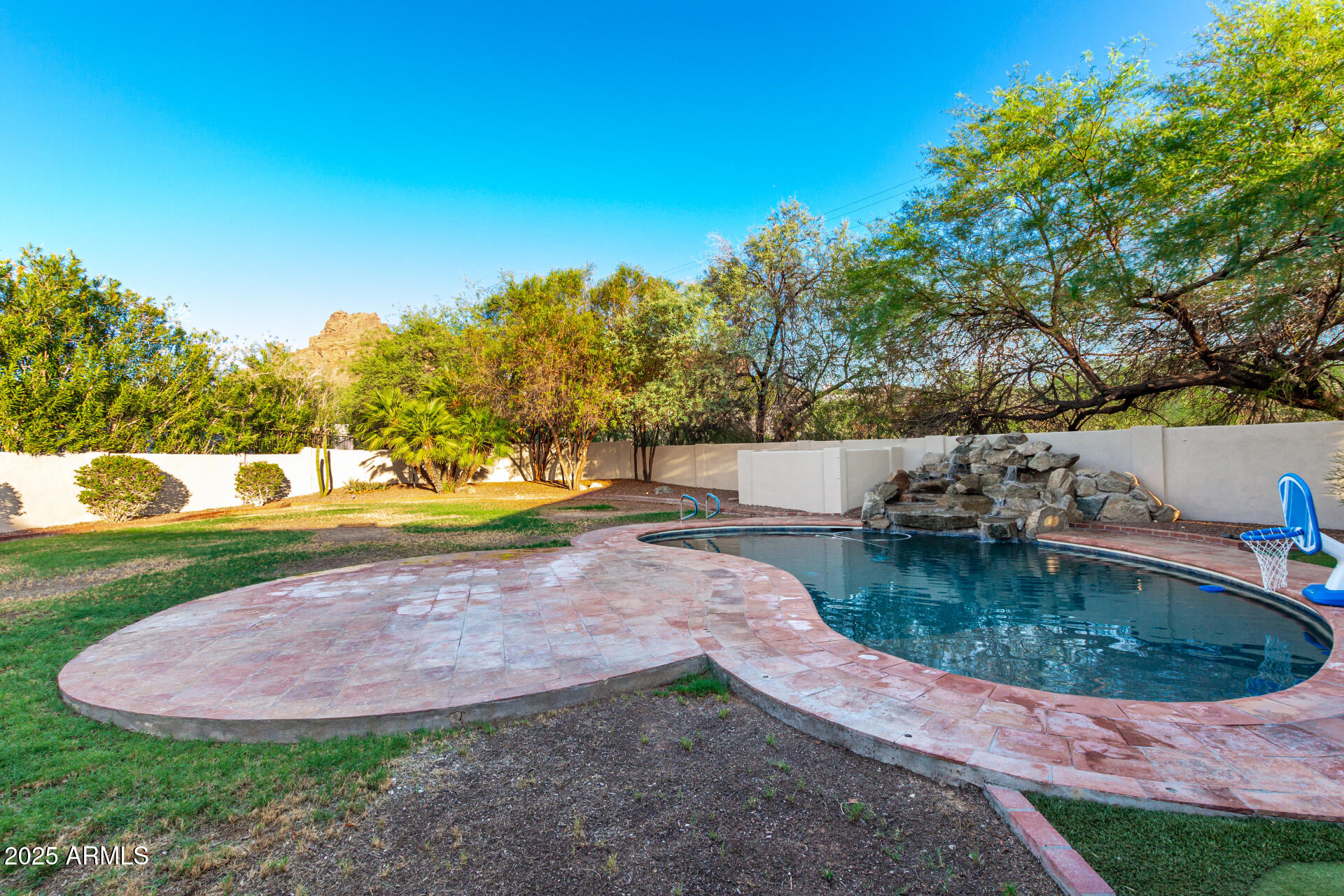 5803 North 45th Street Phoenix, AZ 85018 - Photo 4 of 72 a view of a backyard with swimming pool