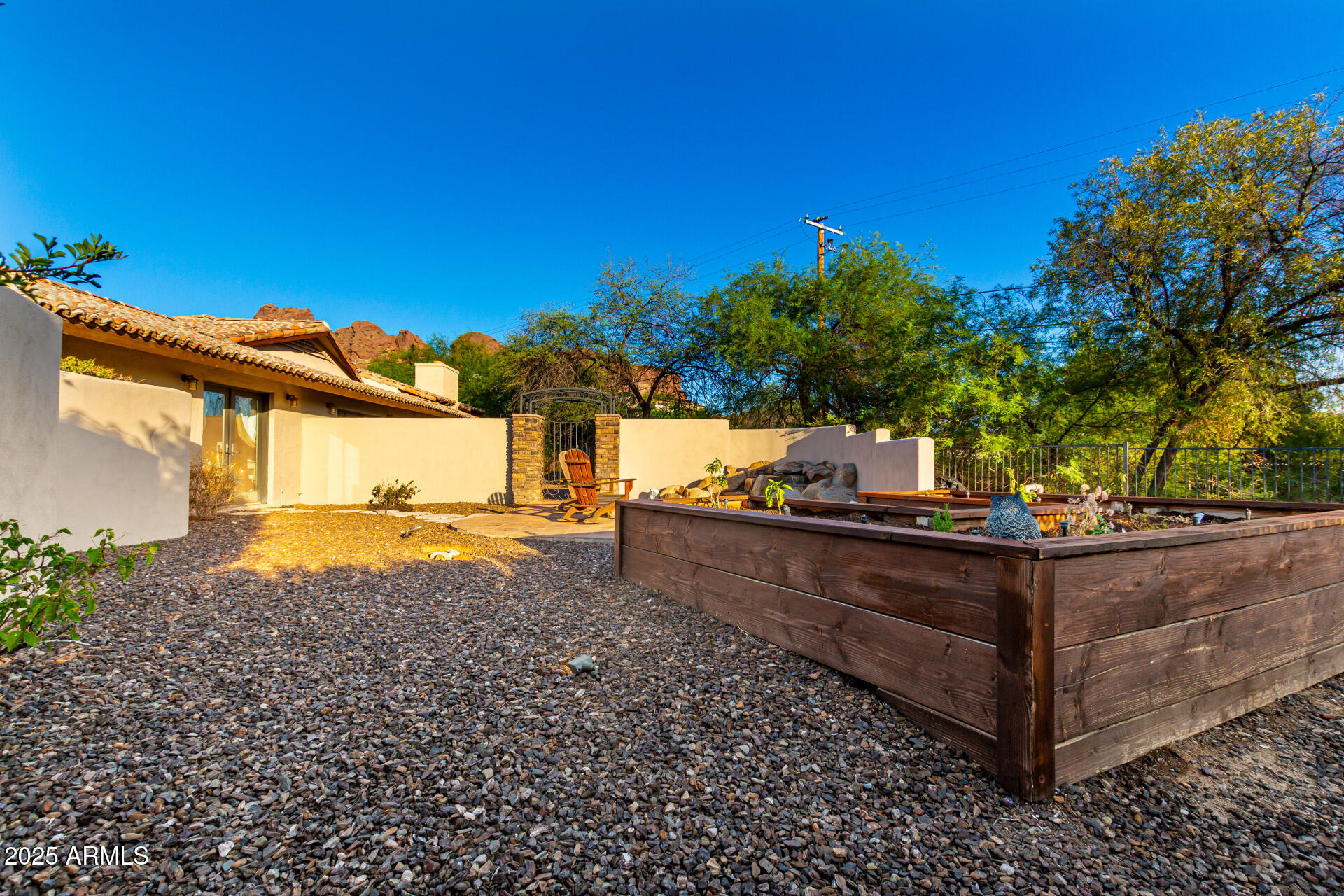 5803 North 45th Street Phoenix, AZ 85018 - Photo 54 of 72 a view of a yard with wooden fence