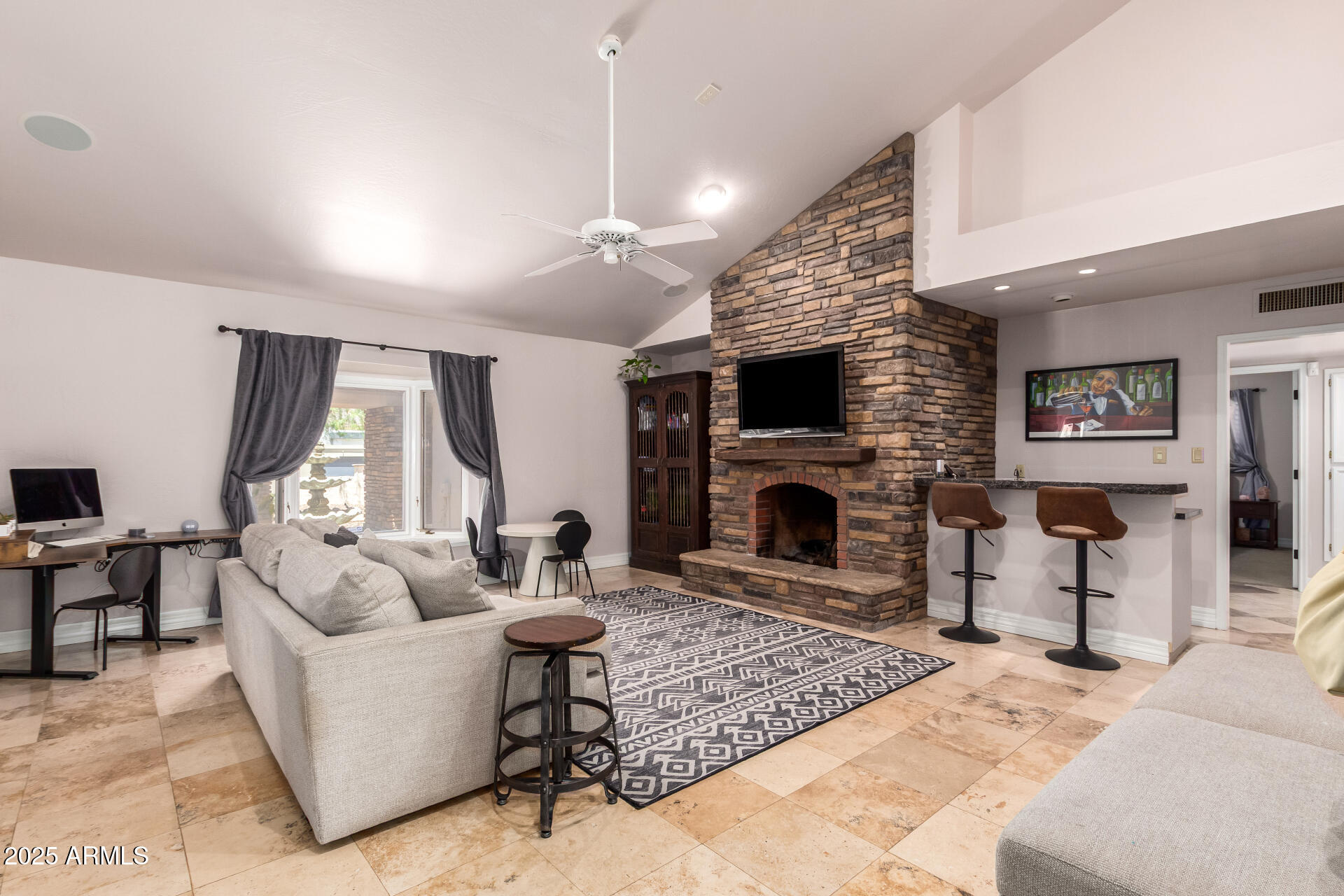 5803 North 45th Street Phoenix, AZ 85018 - Photo 6 of 72 a living room with furniture a large window and a fireplace