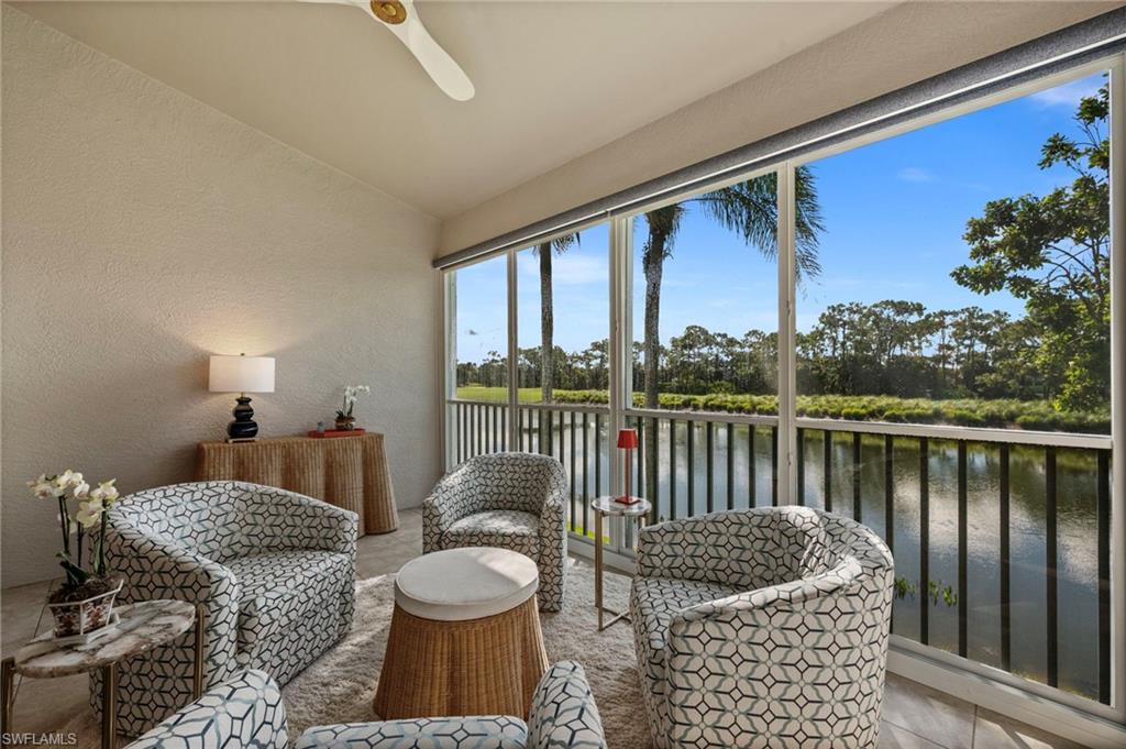 9331 Spring Run Boulevard, Unit 3005 Estero, FL 34135 - Photo 21 of 48 Screened balcony with water and treeline scenery