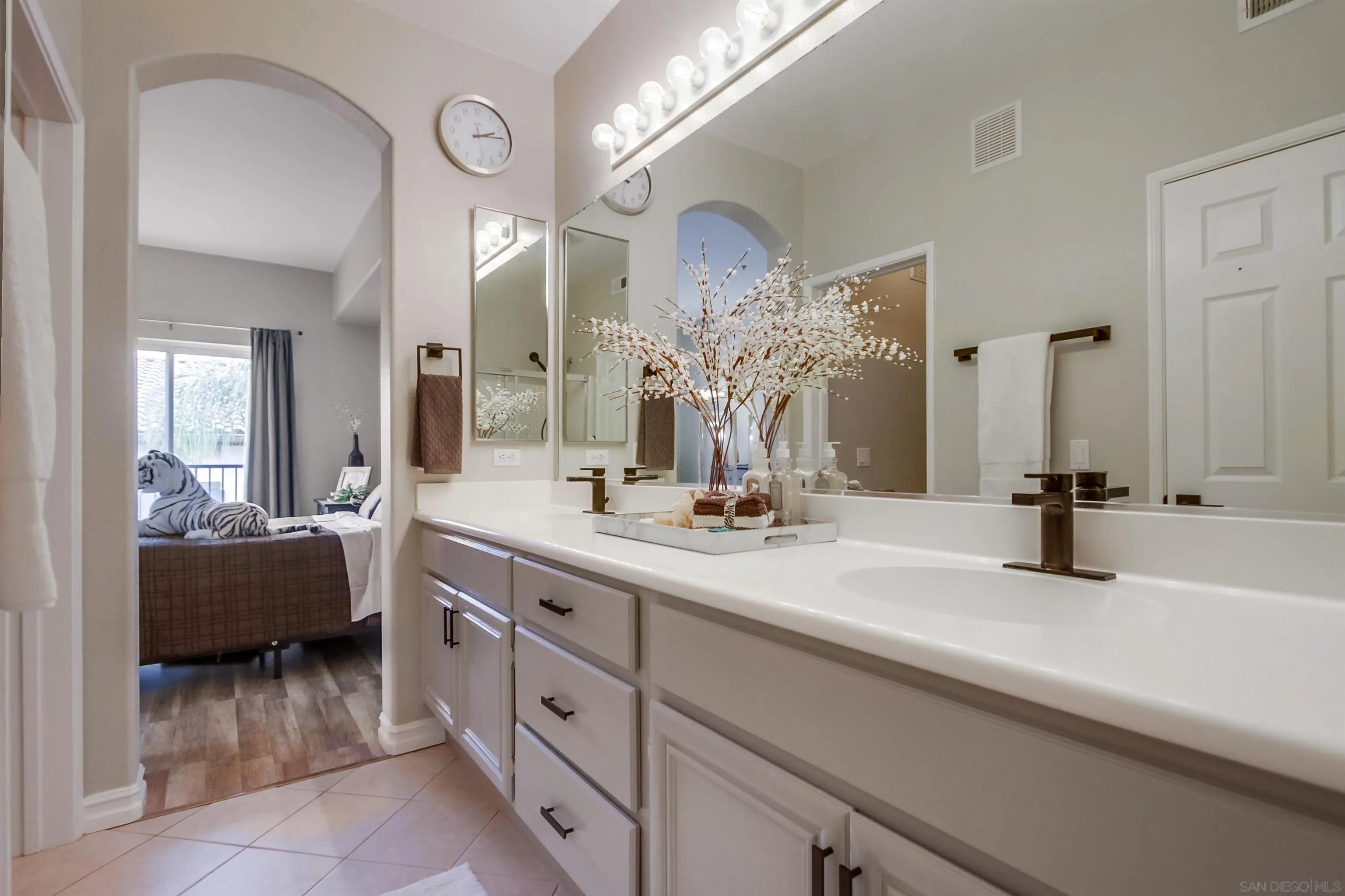 3147 Via Puerta Carlsbad, CA 92009 - Photo 19 of 32 a bathroom with a double vanity sink mirror and bathtub