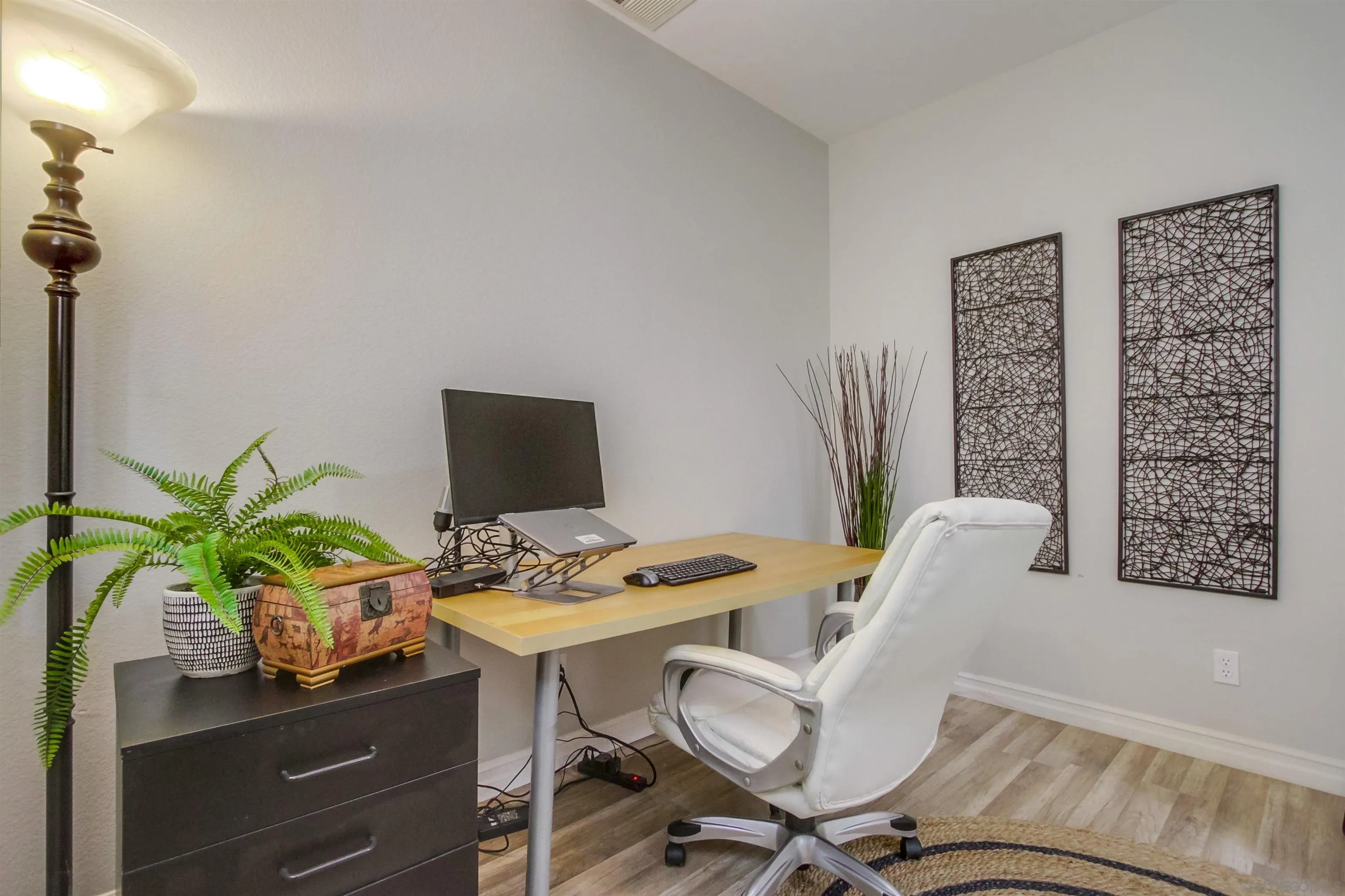 3147 Via Puerta Carlsbad, CA 92009 - Photo 6 of 32 a view of a workspace with furniture and wooden floor