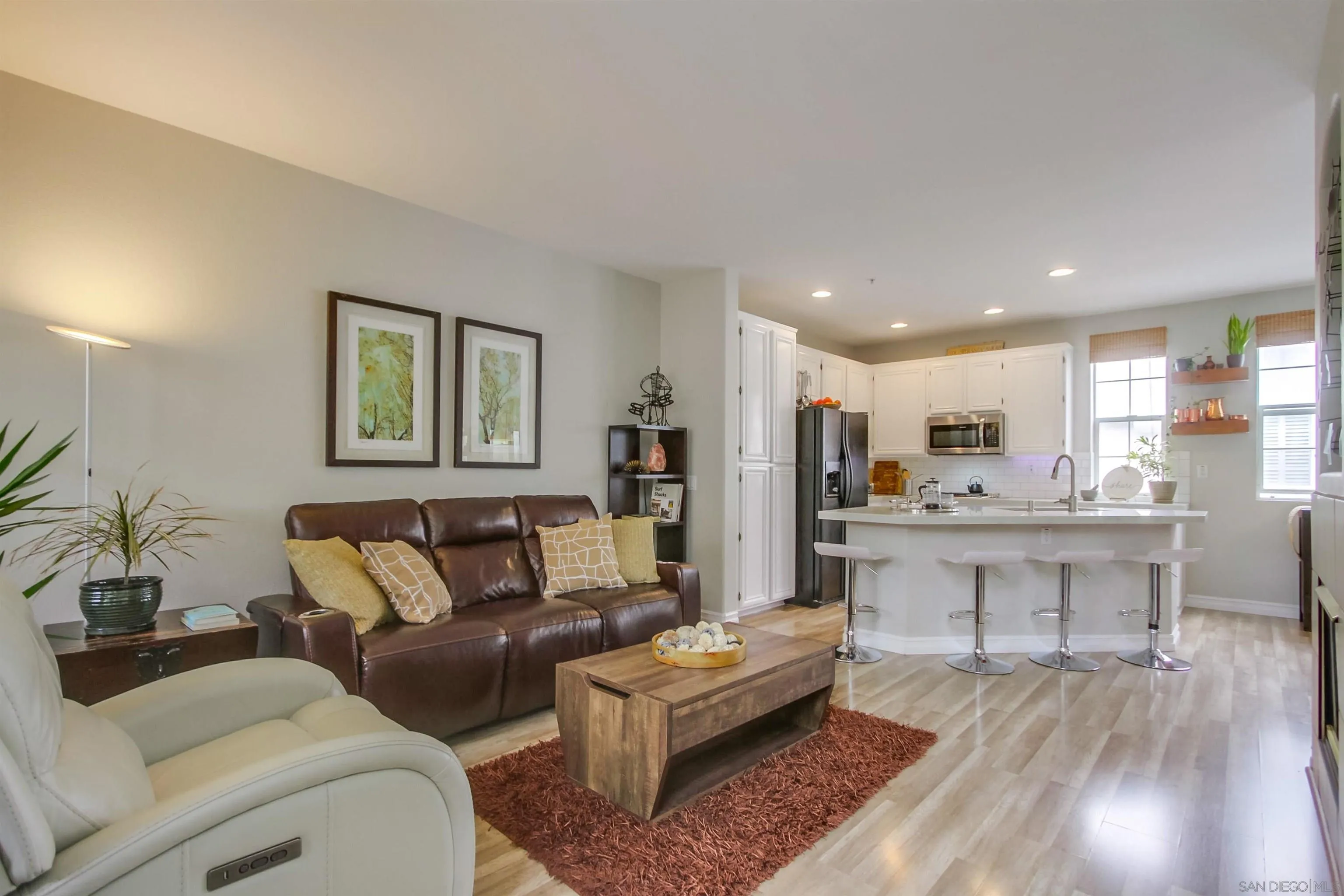 3147 Via Puerta Carlsbad, CA 92009 - Photo 8 of 32 a living room with furniture and a wooden floor