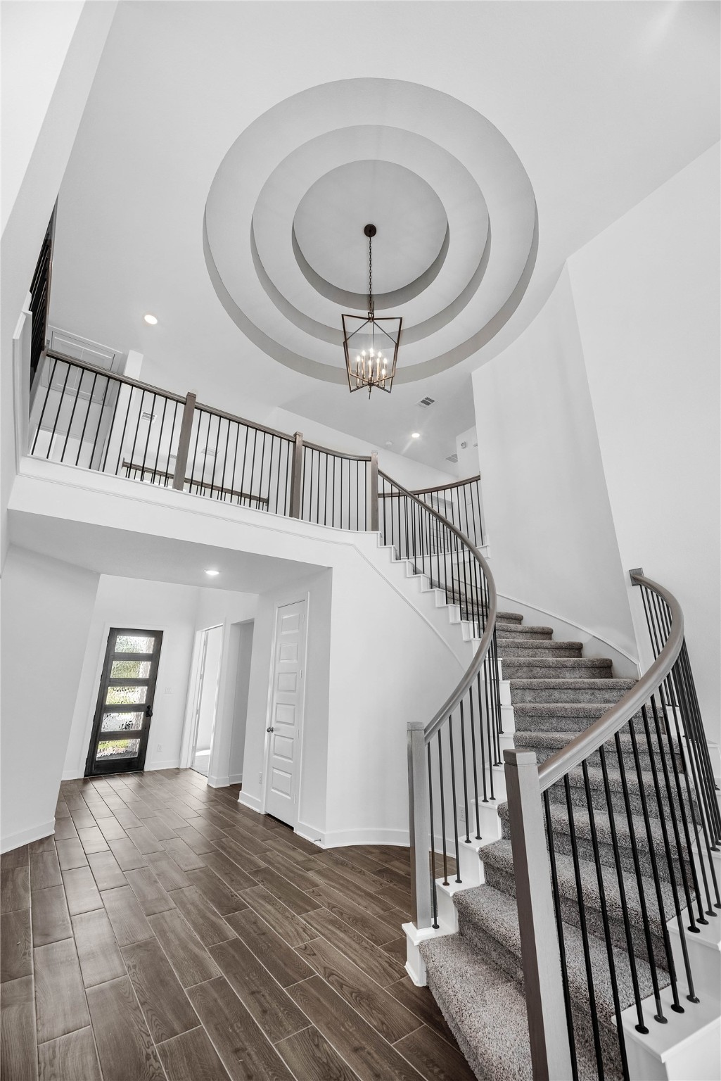 9118 Colonnade Way Manvel, TX 77578 - Photo 2 of 31 a view of entryway and hall with wooden floor