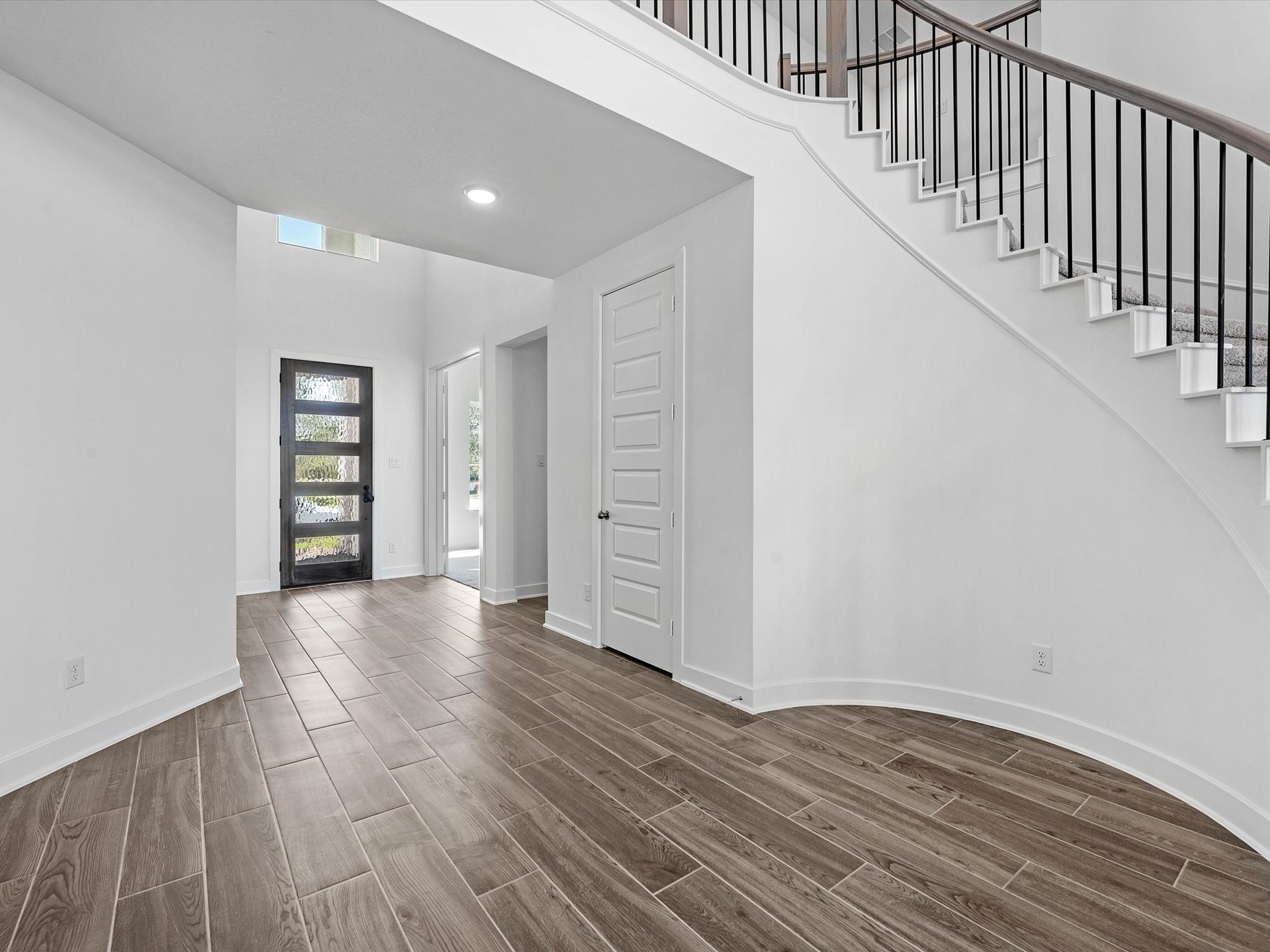 9118 Colonnade Way Manvel, TX 77578 - Photo 3 of 31 a view of an empty room with window and wooden floor