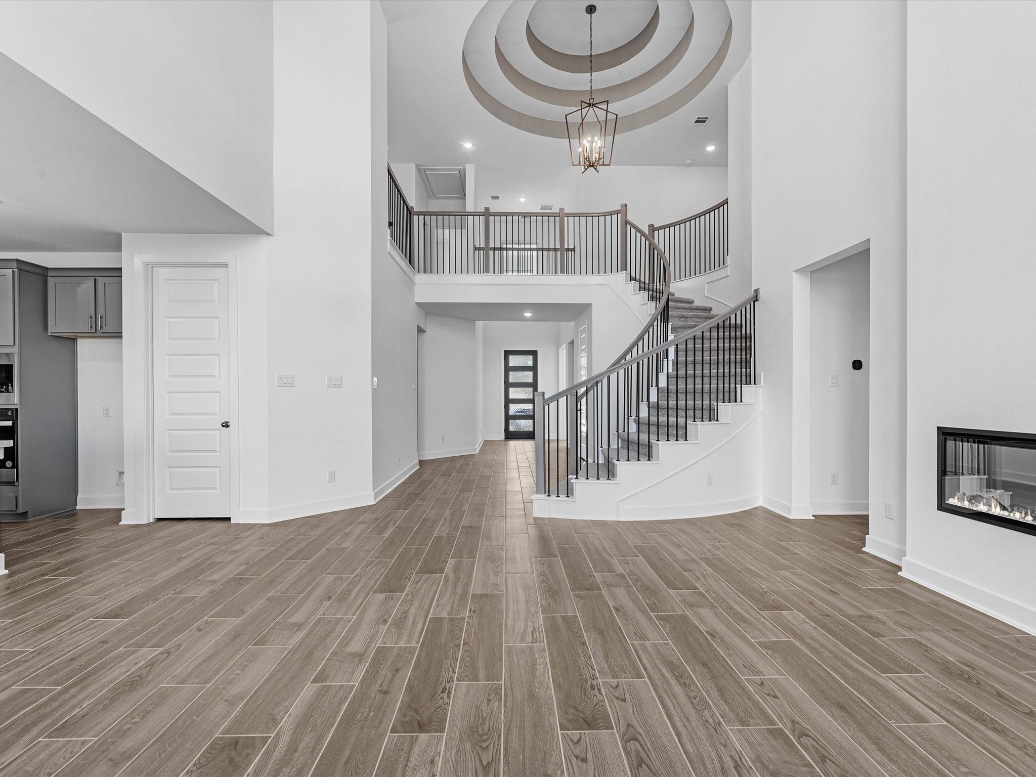 9118 Colonnade Way Manvel, TX 77578 - Photo 7 of 31 a view of entryway and hall with wooden floor