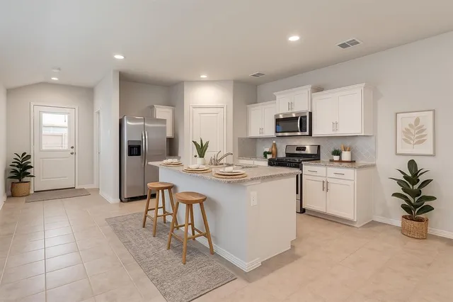 a large kitchen with cabinets