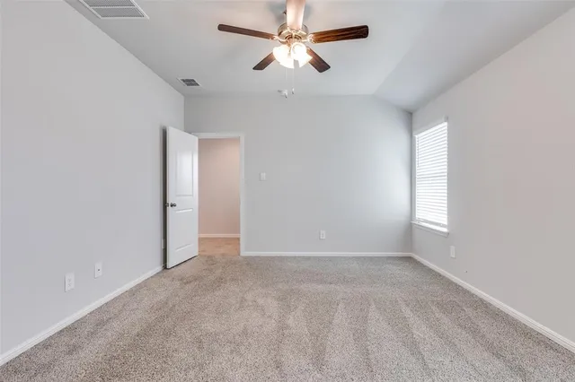 a bathroom with a granite countertop sink mirror and a bathtub