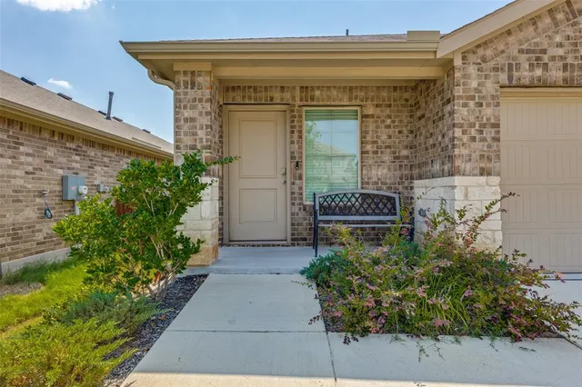 a view of entryway with flower pots
