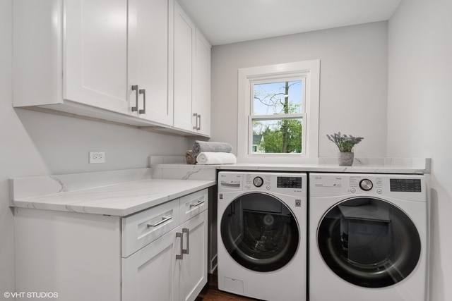 912 Glenwood Road Glenview, IL 60025 - Photo 4 of 6 a utility room with closet dryer and washer
