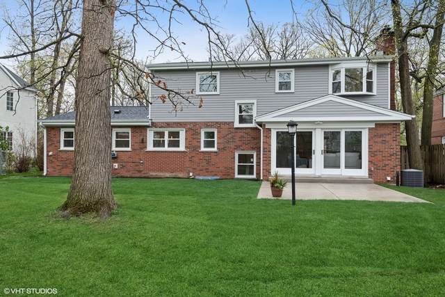 912 Glenwood Road Glenview, IL 60025 - Photo 6 of 6 a brick house with a yard and large trees