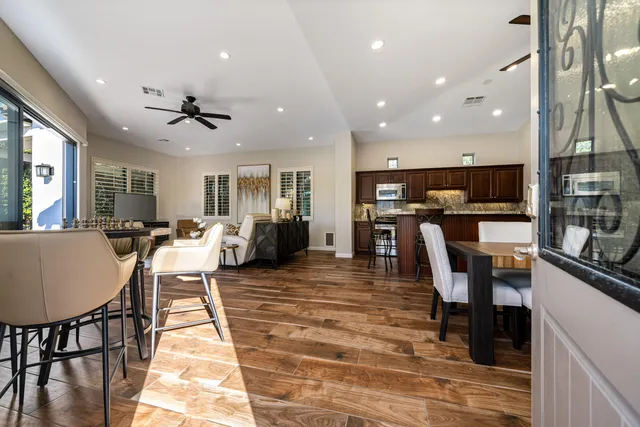a large kitchen with a table and chairs