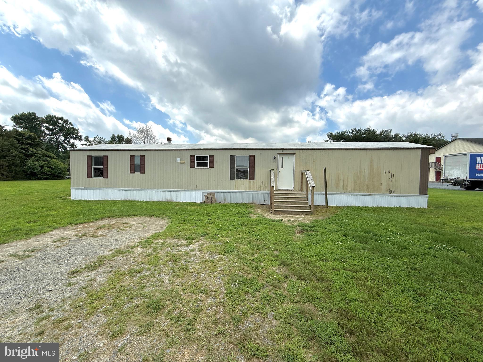 16 Abbotts Pond Road Greenwood, DE 19950 - Photo 12 of 19 a view of a house with a backyard