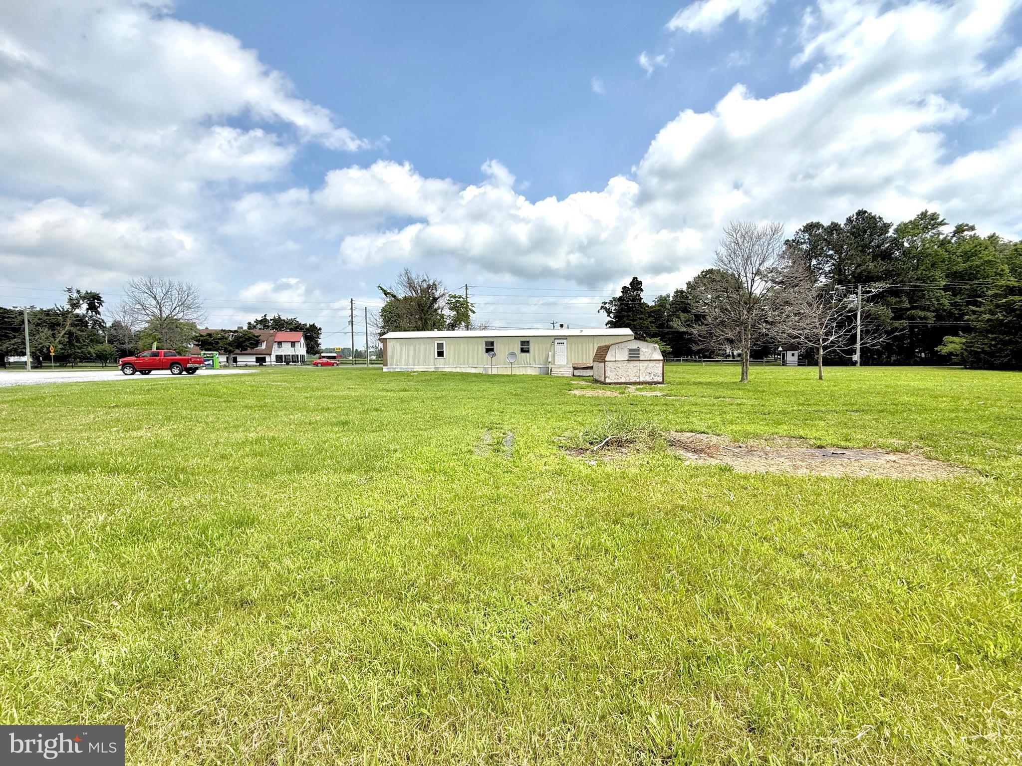 16 Abbotts Pond Road Greenwood, DE 19950 - Photo 4 of 19 a view of a big yard with large trees
