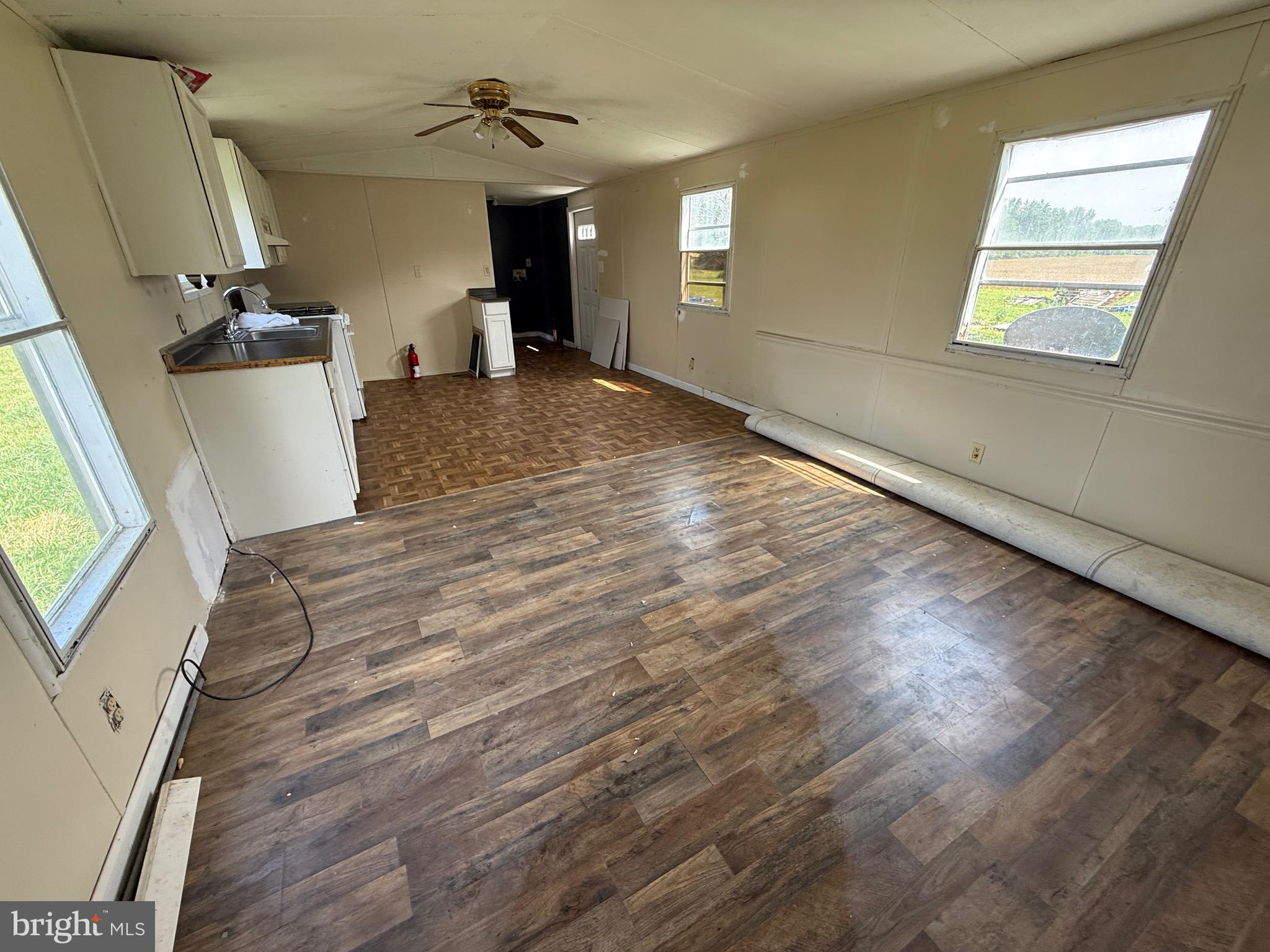 16 Abbotts Pond Road Greenwood, DE 19950 - Photo 7 of 19 wooden floor in an empty room with a window