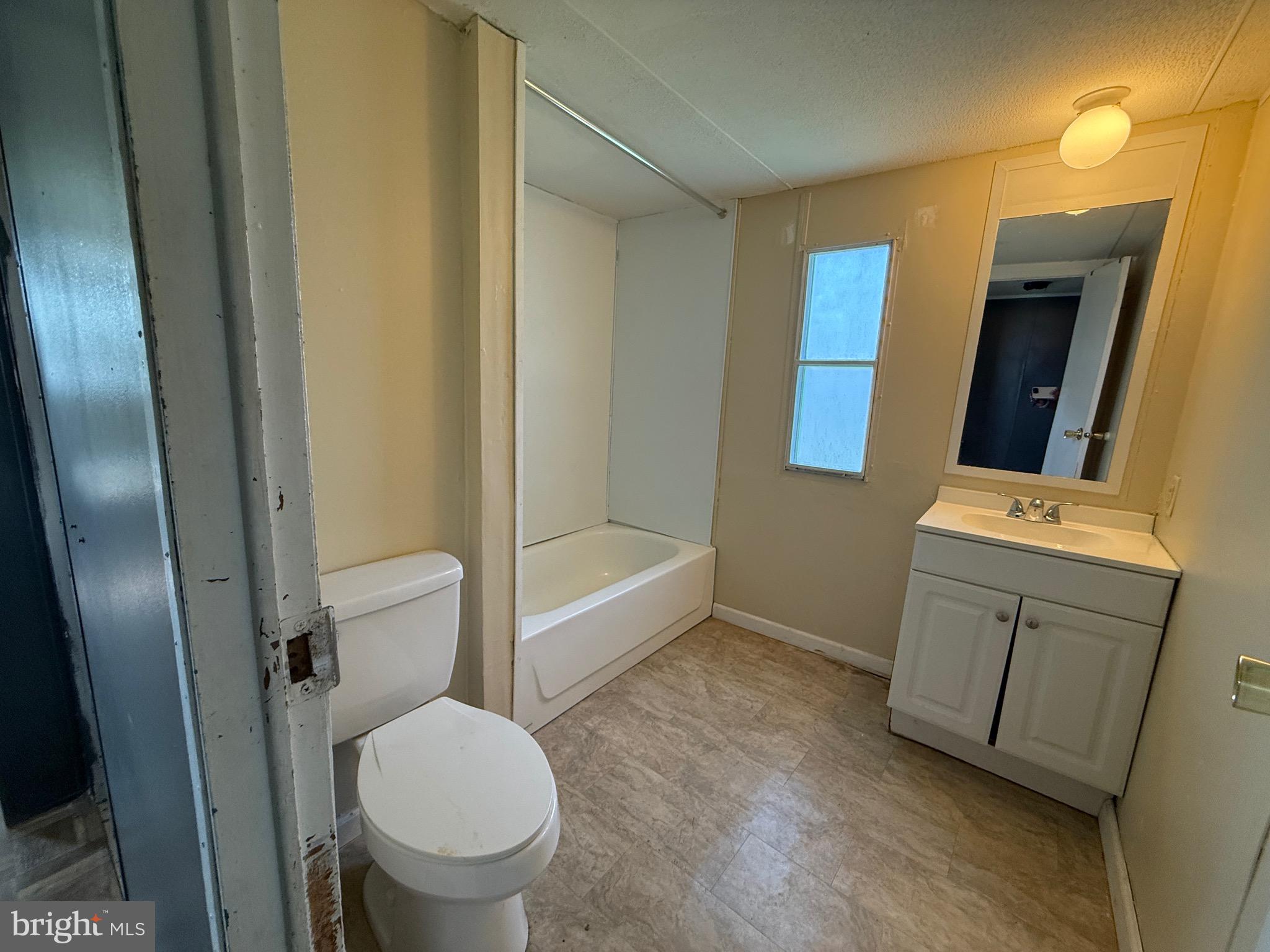 16 Abbotts Pond Road Greenwood, DE 19950 - Photo 8 of 19 a bathroom with a toilet sink and mirror