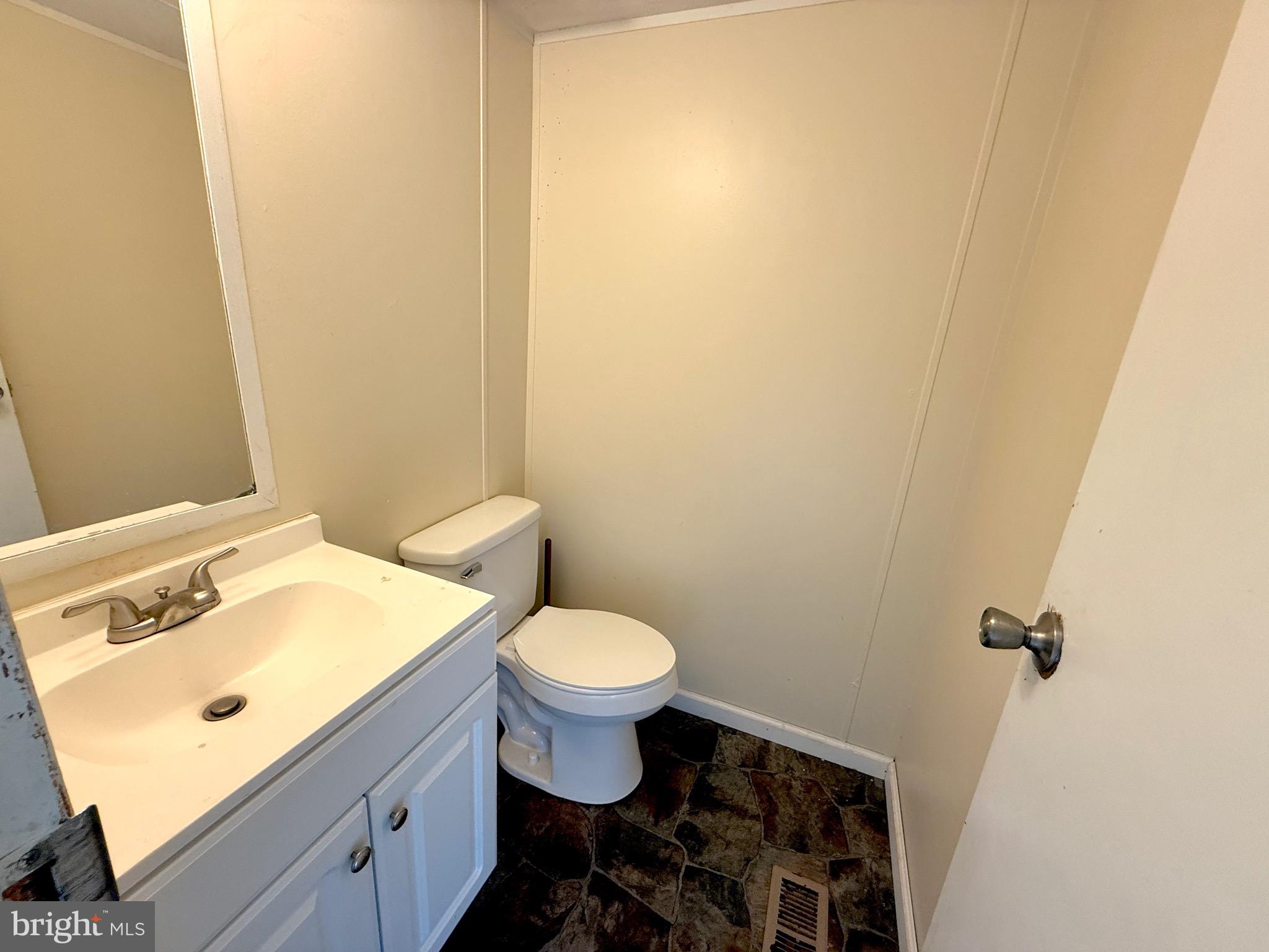 16 Abbotts Pond Road Greenwood, DE 19950 - Photo 9 of 19 a bathroom with a sink and a toilet