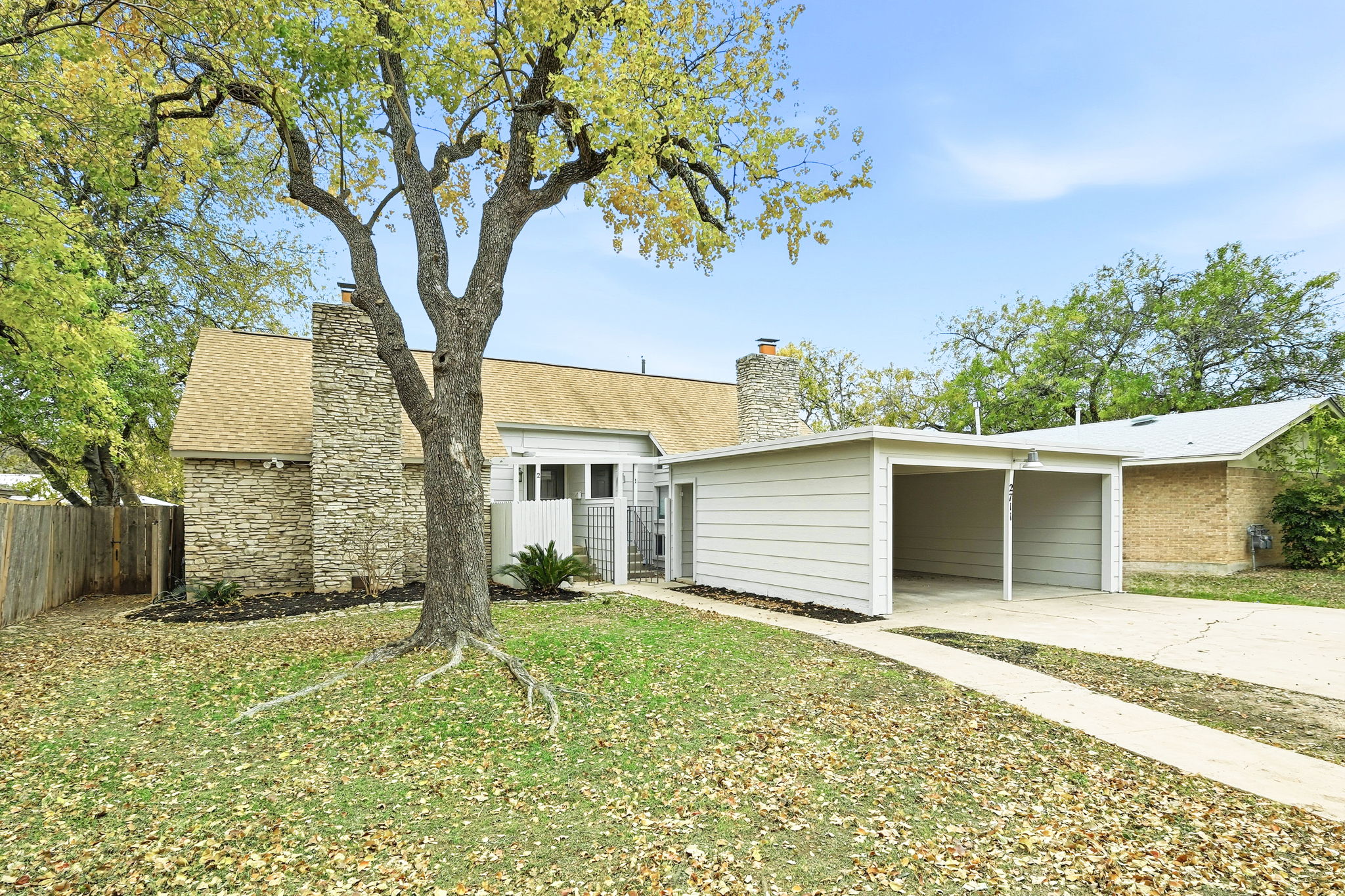 2711 St Edwards Circle, Unit 1 Austin, TX 78704 - Photo 1 of 1 front view of a house with a tree