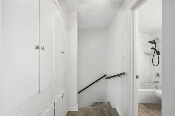 a bathroom with a glass shower door