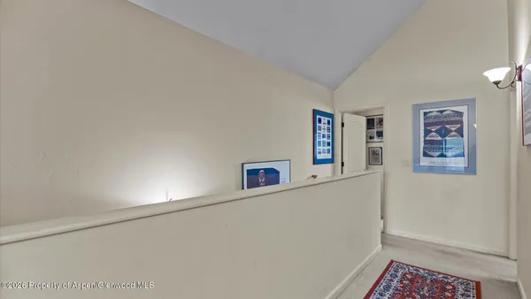 a view of a hallway with workspace