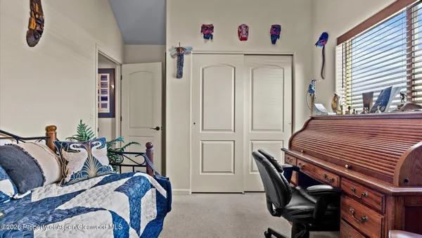 a bedroom with furniture and a bed