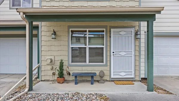 a front view of a house with outdoor seating