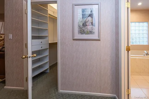 a view of an empty room and a window