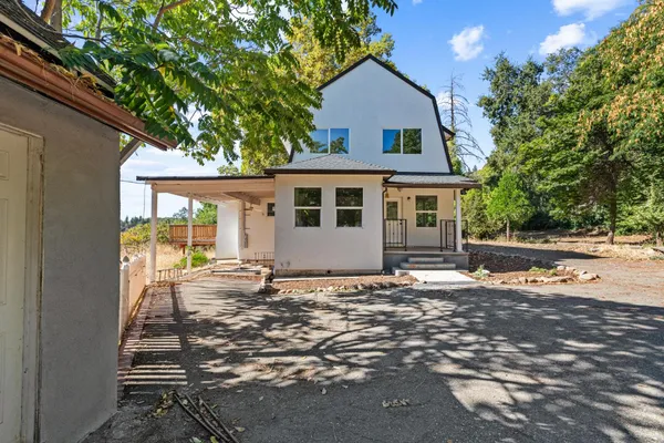 a front view of a house with a yard