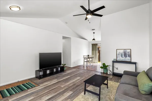 a living room with furniture and a flat screen tv