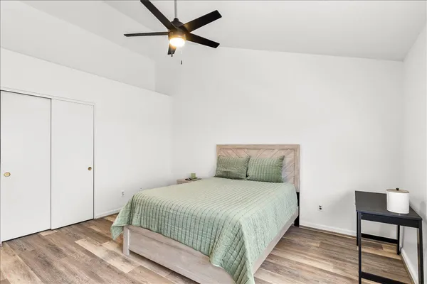 a bedroom with a bed and a chair