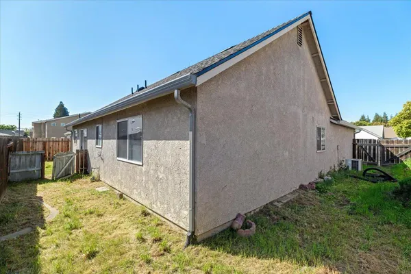 a house view with a backyard space
