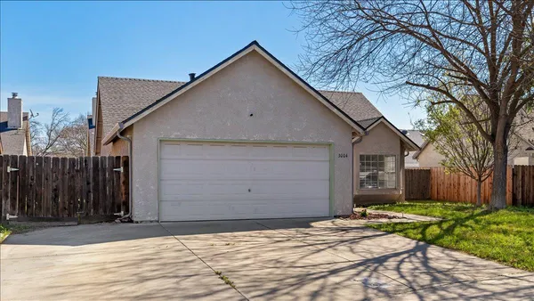 a view of garage yard and tree