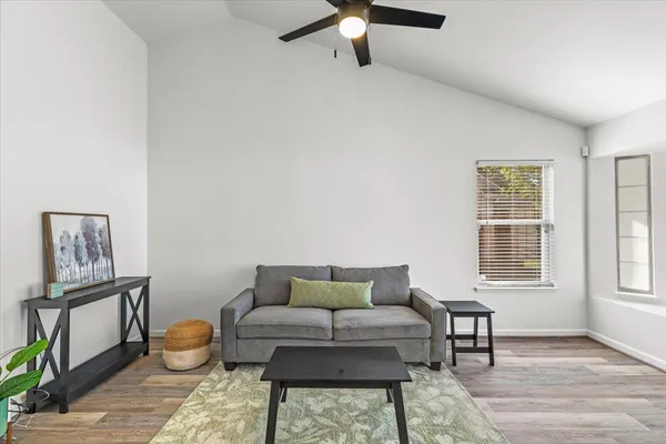 a living room with furniture and a window