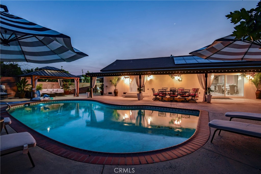 9728 Rhea Avenue Northridge, CA 91324 - Photo 33 of 36 a view of a swimming pool with an outdoor seating