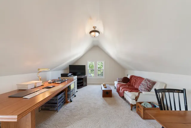 a reading room with furniture and a window